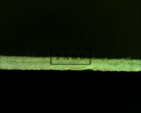 THE MUMMY'S HAND halfsheet - Here we see the halfsheet edge-on under the microscope. we can see the layers. On the bottom is the paint layer comprised of airbrush paint. The middle layer is the modern paper, upon which the ink jet printing lies, and the top layer is from an original, vintage halfsheet of unknown title which has been pared down by sanding so as to make it about half it's normal thickness. (Poster)