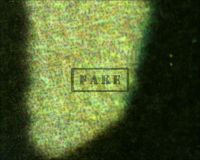 DRACULA one sheet R 47 #2 - Here a microscope image of the "L" in the word "RELEASE" seen at the bottom right. Here, again we should only see raw, naked, fibrous, unprinted paper and instead we see ink jet printer dots which mimic the look of old paper. (Poster)