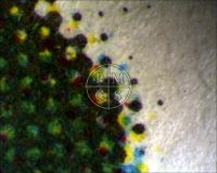 DESTINATION MOON - Microscopic image of the rocket fin displaying a clear contrast between the unprinted original paper fibers and the off-set lithography style of printing used for this poster. (Poster)